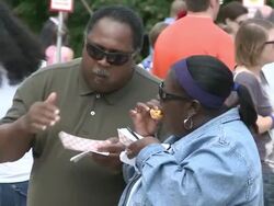 People Eating Hot Dogs At Hot Dog Fest Stock Footage