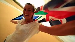 Self portrait of caucasian female holding Australian flag on beach Stock Footage
