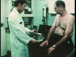 A cardiologist uses medical equipment to check a patient's pacemaker. News Clip
