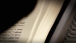 A hand points from one word in a french dictionary to another. Stock Footage