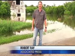 On top of a hill, with an American flag blowing in the wind, is a makeshift camp for Burlington residents whose homes have been washed under. Robert Ray has the story. News Clip