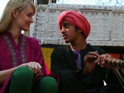 Young woman talking with a indian boy, Suraj Kund, Faridabad, Haryana, India Stock Footage