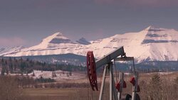 HD: Pumpjack in Mountain Setting Stock Footage