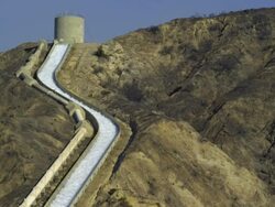 MS, Aqueduct in mountain landscape, Sylmar, California, USA Stock Footage