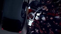 Chauffeur opens limousine door, celebrity signs autographs for eager fans at awards show Stock Footage