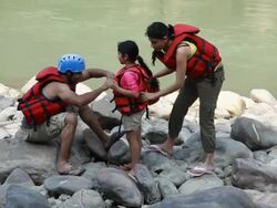Family preparing for river rafting  Stock Footage