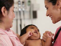 "CU medical worker with infant hispanic patient/Richmond,Virginia, USA " Stock Footage