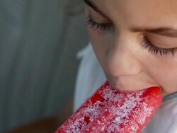 Girl eating an ice lolly Stock Footage