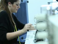 Female tailor working on sewing machine in factory Stock Footage