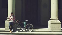 Hipster guy with bicycle in Firenze, Italy Stock Footage