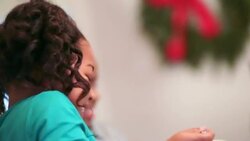 Cute young girl rubs hands together hungrily before serving herself a heaping spoonful of mashed potatoes Stock Footage