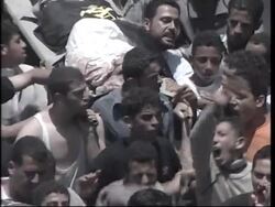 WRAP Mass funeral, mourners run for cover News Clip