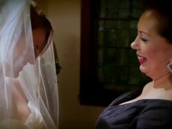 Mom adjust bride's veil and gives her a hug Stock Footage