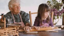 Cooking With Grandma-Beautiful Little Girl Learns How To Make Cookies  in The Bright-lit Vintage Kitchen Stock Footage