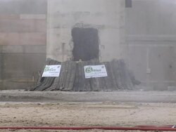 MS  Smokestack  is demolished using explosives - base of chimney explodes and it falls toward / Netherlands Stock Footage