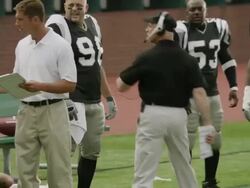 MS, PAN, American football coach yelling at players from sidelines, Staten Island, New York, USA Stock Footage