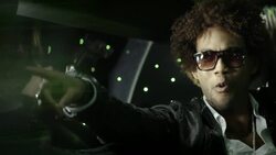 Hip-hop star points to fans in the crowd while paparazzi snap photos through window at awards show Stock Footage