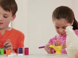 Brother and sister painting easter eggs Stock Footage