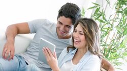 Couple social networking on a tablet computer Stock Footage