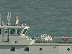 CU AERIAL ZI ZO Shot of customs petrol craft moving ahead in sea / Suffolk, France Stock Footage