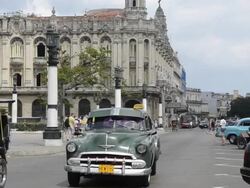 Traffic with old cars in front of Capitol building Havana Cuba Stock Footage
