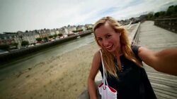 Young woman taking a selfie in Trouville harbour,Normandy-France Stock Footage