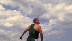 An athlete throws a javelin through the sky. Stock Footage