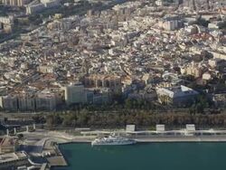 Aerial view of city and port with lighthouse, Malaga, Andalusia, Spain Stock Footage