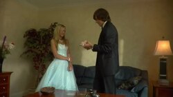 MS, Young man putting corsage on teenage girl's (16-17) wrist in living room, Edison, New Jersey, USA Stock Footage
