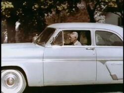 Frustrated woman driver tries to get through town Stock Footage