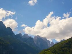WS T/L Shot of Paragliders circling at alpine mountain peaks "Dolomiti di Brenta" / Molveno, Trentino, Italy Stock Footage