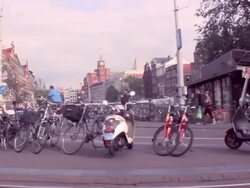 WS PAN Trolley pulling into station to reveal bicycles / Amsterdam, Netherlands Stock Footage