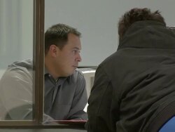 2009 MS Man processing customer's paperwork at counter in job center/ Antioch, California, USA/ AUDIO Stock Footage