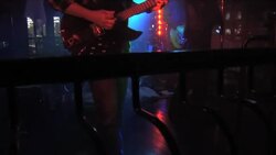 Guitarists play in a nightclub as a singer performs. Stock Footage