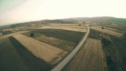 Aerial panorama over green fields farms summer Stock Footage