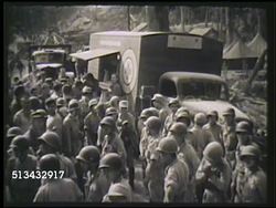 1945: RED CROSS: CLUBMOBILE: VS United States soldiers, Marines, crowded around Red Cross Clubmobile. VS Female Red Cross workers pouring drinks for soldiers, soldiers enjoying food, music records. WWII, Club-Mobile, Club Mobile Instructional Video