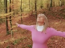 HD STEADY SHOT: Woman Throwing Leaves In The Air Stock Footage