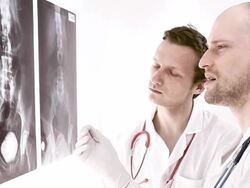 Doctor reviews x-ray Stock Footage