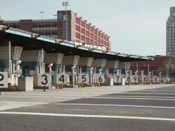 Time lapse, toll booth exits, multiple cars and traffic drive away down the interstate highway. Stock Footage