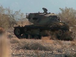 WS R/F Broken down tank in the desert Stock Footage