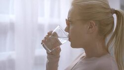 Woman drinking water Stock Footage