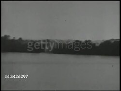 1944: BATTLE OF WAKDE: VS U.S. artillery regiment firing artillery cannons on island of Wakde. VS 163rd Infantry Regiment soldiers in landing crafts approaching beach, landing. World War II, WWII, Pacific Front, New Guinea Campaign, amphibious assault Instructional Video