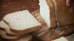 Cutting Bread into Slices Stock Footage
