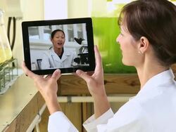 CU PAN Scientist in Biology Tech Laboratory Video Chatting with Researcher on Tablet Computer / Eastville, Virginia, United States Stock Footage