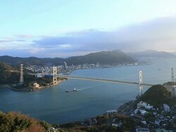 WS View of traffic moving on Kanmonkyo Bridge / Yamaguchi, Yamaguchi Prefecture, Japan Stock Footage