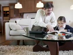 Father helps daughter with home work Stock Footage