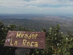 WS, Nicaragua, Volcan Mombacho Natural Park, Lake Nicaragua and Mirador La Roca wooden sign in foreground Stock Footage