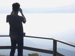 Silhouette close up : young man take a panorama photo Stock Footage
