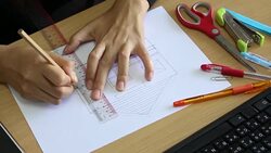 Female architect drawing house in office Stock Footage
