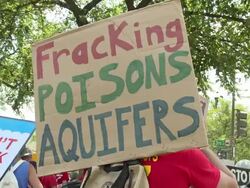 Protesters march, chant and hold up signs against fracking and Cove Point Stock Footage